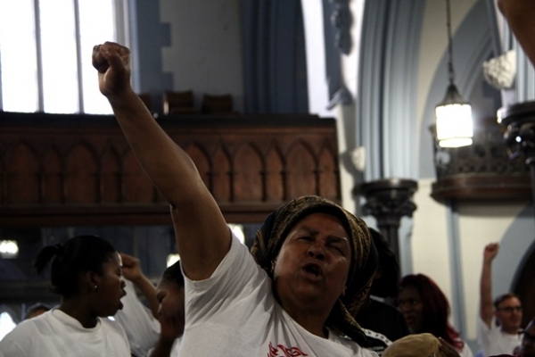 Juliet Plaatjies, a Social Justice Coalition member from Khayelitsha, joins in singing struggle songs at the Right2Know campaign's mass meeting in the CBD. Picture by Daneel Knoetze.