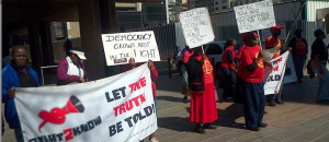 R2K members picketing outside the Arms Deal Commission. 